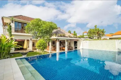 an image of a swimming pool in front of a house at 4 Bedroom Private Villa Umalas 2 in Seminyak