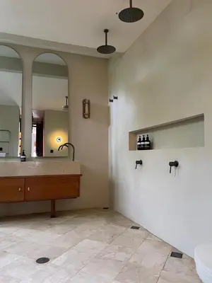 a bathroom with a sink and a large mirror at Top Villa Ilo, best area near canggu 250 m2 on 750 m2 land in Kerobokan