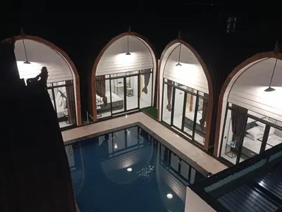 an overhead view of a swimming pool in a building at HK Villa Family in Seminyak