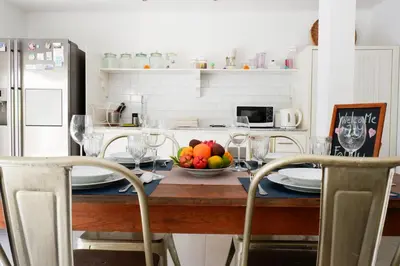 a kitchen with a table with a bowl of fruit on it at VILLA BELLA - 7Min Beach Access - 10min to Canggu in Canggu