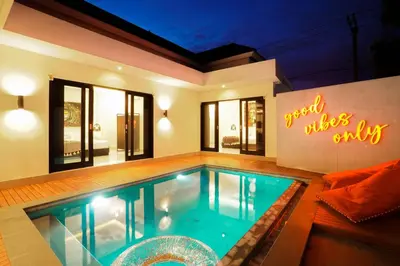 a swimming pool in the middle of a house at Stylish Umalas 2BR Villa With Private Pool in Kerobokan
