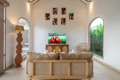 a living room with a couch and a table at Bambola - Stunning Luxury Villa in Kerobokan in Canggu
