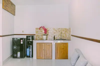 a kitchen with a sink and a counter at Sejati Villas - Petitenget in Seminyak