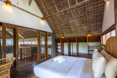 a bedroom with a white bed in a room at Villa Vintage 3 in Canggu