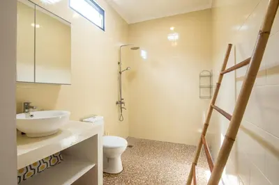 a bathroom with a sink and a toilet and a shower at Canggu - Villa Romy - 2 Bedrooms - Private Pool in Kerobokan