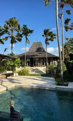 a villa with a pool in front of a resort at Kudus Boutique Estate in Canggu 100m to Beach in Canggu