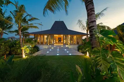 a villa with a pathway leading to a building at Kudus Boutique Estate in Canggu 100m to Beach in Canggu