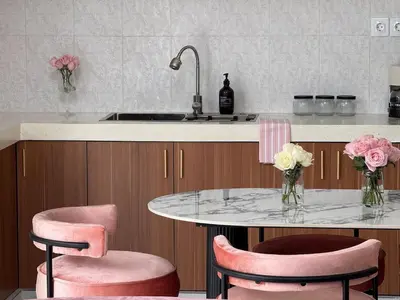 a kitchen with pink chairs and a table and a sink at LUX 2 Bed Villa - Berawa in Canggu