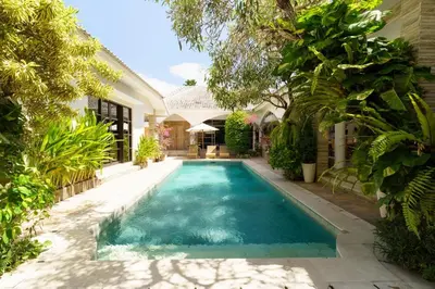 a swimming pool in the backyard of a house at Villa Nirvana Seminyak in Seminyak