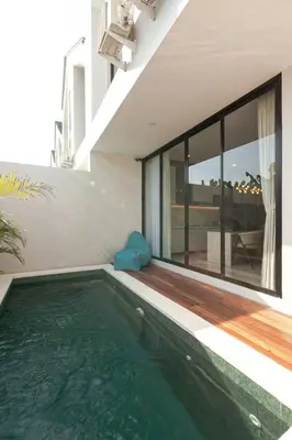 a swimming pool in the middle of a house at Yearly Rent Seminyak Huis19 Villa in Seminyak