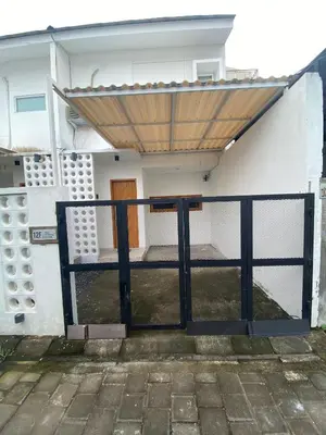 a gate to a house with a wooden door at Home Stay Room In Bali Near Sanur Beach in Sanur
