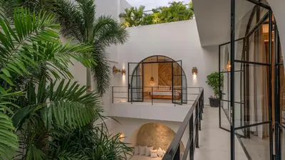 a hotel lobby with plants and a mirror at Villa Unna in Canggu by Elite Havens in Canggu