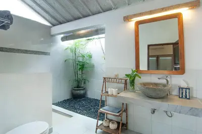 a bathroom with a sink and a mirror at AMAZING 1 BR Villa Private Pool walk to beach in Seminyak