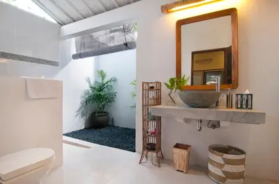 a bathroom with a sink and a mirror at AMAZING 1 BR Villa Private Pool walk to beach in Seminyak