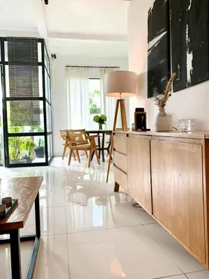 a living room with a couch and a table at Aesthetic Villa Central Canggu With an Office in Canggu