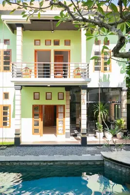 a house with a pool in front of it at Villa with private pool and garden in Nusa Dua 3BR in Nusa Dua