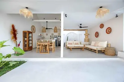 a living room and dining room with a table at Casa Kokoon - NEW Bright & Quiet 2BR Mertanadi Seminyak with Private Pool and Parking in Seminyak
