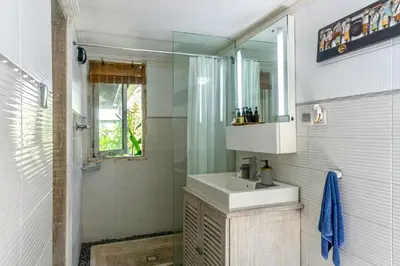 a bathroom with a sink and a shower at Villa Nari - GG100X Seminyak, Bali in Seminyak