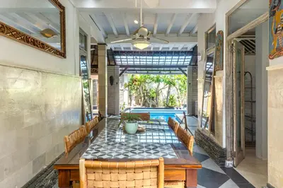 a dining room with a table and chairs at Villa Nari - GG100X Seminyak, Bali in Seminyak