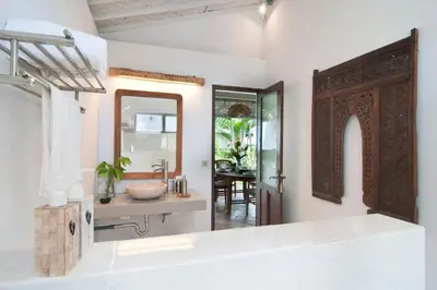 a bathroom with a sink and a mirror at COZY 2 BR Villa Private POOL walk to the beach in Badung