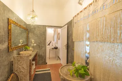 a bathroom with two sinks and a mirror at Smile - One Bedroom Villa in the Seminyak center in Seminyak