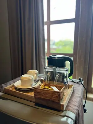 a tray with a tea set on top of a table at Blue Diamond Residenses Seminyak in Seminyak