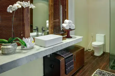 a bathroom with a sink and a toilet at Room & Vespa 3 - Relaxing Stay Center Seminyak in Seminyak