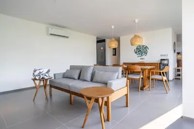 a living room with a couch and a table at Casa Nadi in Seminyak