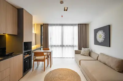 a living room with a couch and a table at de' Asasta Apartment Benoa N-511 in Nusa Dua