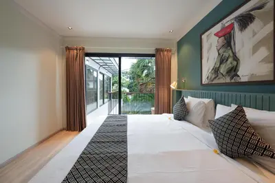 a bedroom with a large bed and a large window at Villa Cora Seminyak Walk to Double Six Beach in Seminyak