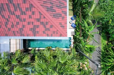 an overhead view of a swimming pool next to a building at Villa Cora Seminyak Walk to Double Six Beach in Seminyak