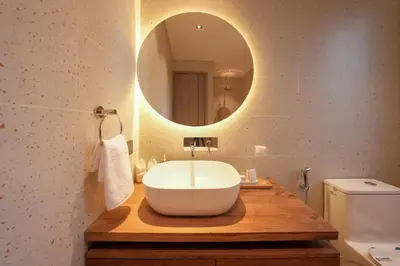 a bathroom with a white sink and a mirror at Villa Cora Seminyak Walk to Double Six Beach in Seminyak