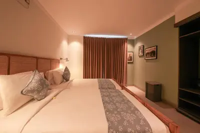 a bedroom with a large bed and a window at Villa Cora Seminyak Walk to Double Six Beach in Seminyak