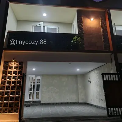 a building with a sign that reads at Home88 Sanur in Sanur