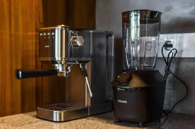 a blender sitting on top of a counter next to a blender at Brand New 4BR Villa with Pool, Sauna & Fire pit close to Nusa Dua and Uluwatu in Jimbaran