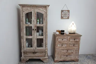 a wooden cabinet next to a wooden dresser at Santai Suites Nusa Dua-Child Free in Nusa Dua
