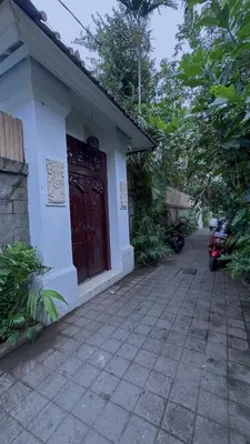 a building with a red door on the side of it at A strategic 2 bedroom villa in seminyak in Seminyak