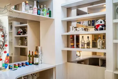 a bar with lots of bottles of alcohol at Villa Azure 2 - Master Suite in shared Pool Villa in Seminyak