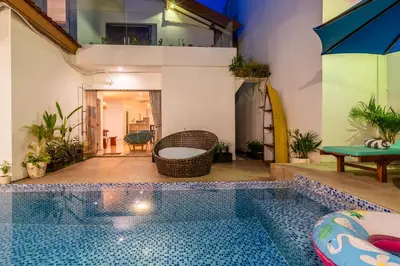 a swimming pool in the middle of a house at Villa Azure 2 - Master Suite in shared Pool Villa in Seminyak