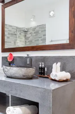 a bathroom with a sink and a counter with a sink at The Clovewood Villa in Seminyak