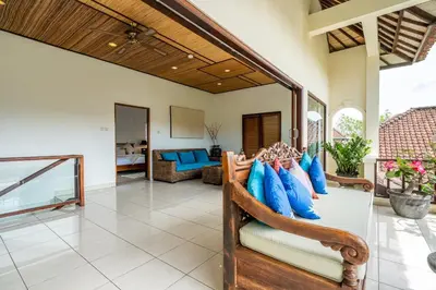a living room with a couch and a table at Tropical Villas - 2 Bed & 3 Bed in Kerobokan