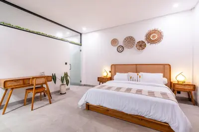 a bedroom with a bed and a desk at 3Br New Private Family Villa- Sanur in Sanur