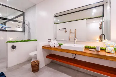 a bathroom with a sink and a mirror at 3Br New Private Family Villa- Sanur in Sanur