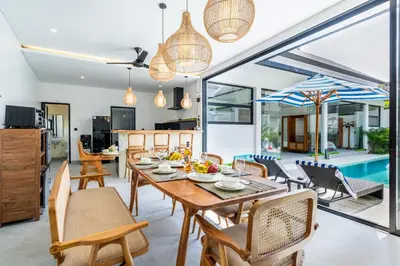 a kitchen and dining room with a table and chairs at 3Br New Private Family Villa- Sanur in Sanur