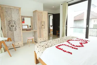a bed with a heart made out of red beads at Villa Stephana Edge of Seminyak in Canggu