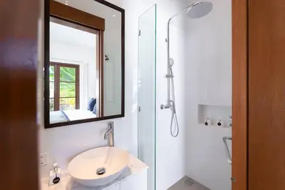 a bathroom with a sink and a shower with a mirror at Gorgeous 1 Bed Pool Villa, Walk to Beach, Shops in Seminyak
