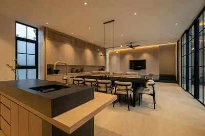 a kitchen and dining room with a table and chairs at Marvee Villa Bali in Canggu