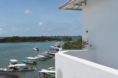 a group of boats are docked in the water at Stunning Sea Front Villa 4BR Nusa Dua in Badung