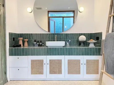 a bathroom with a sink and a mirror at Villa Gamelan Bohème Chic Bali in Seminyak