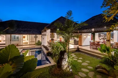 an exterior view of a house with a swimming pool at Tropical Oasis of Calm in the Heart of Seminyak, 4BR Villa Luisha in Seminyak